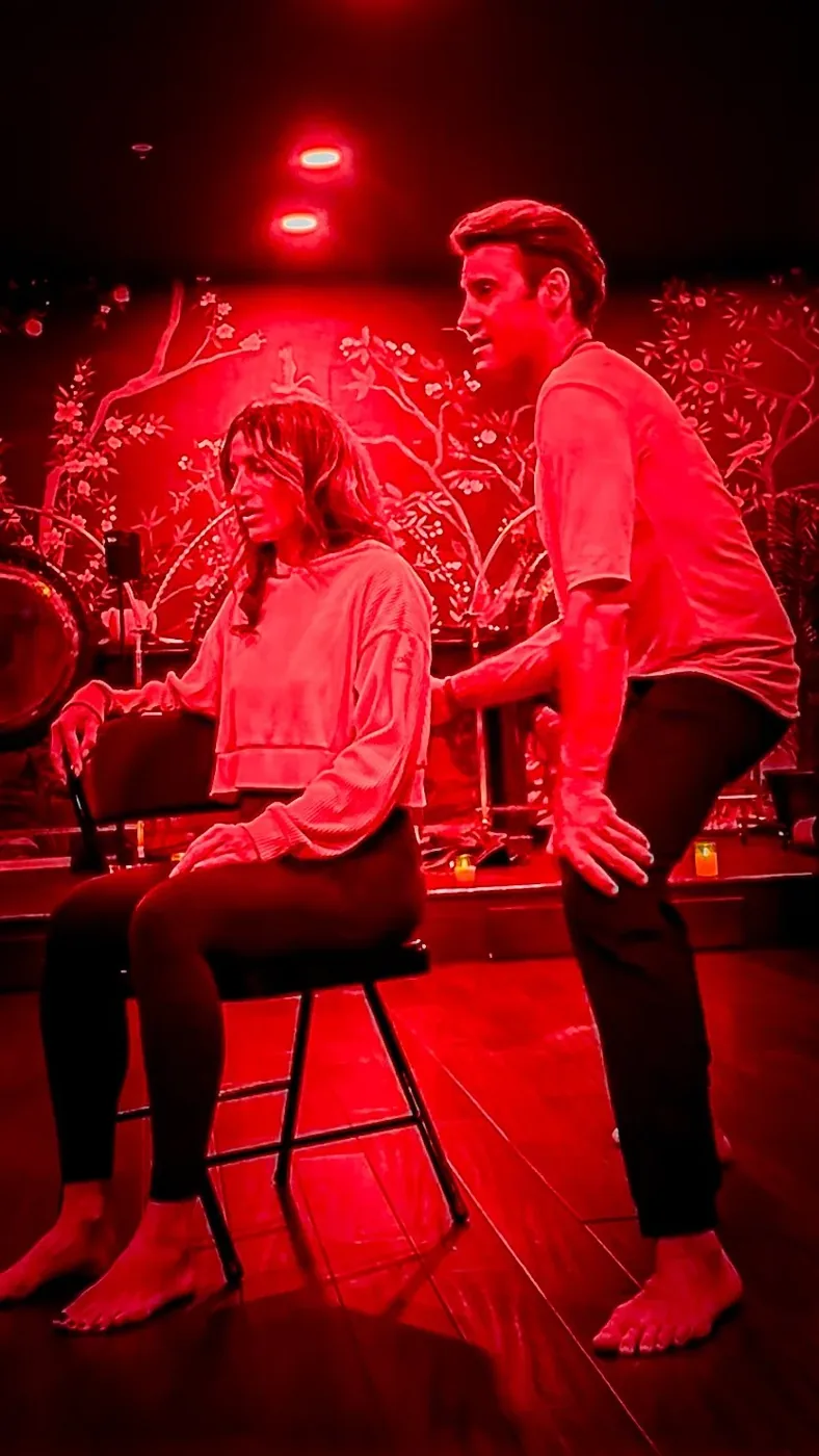 Joel treating Olga's lower back at a workshop