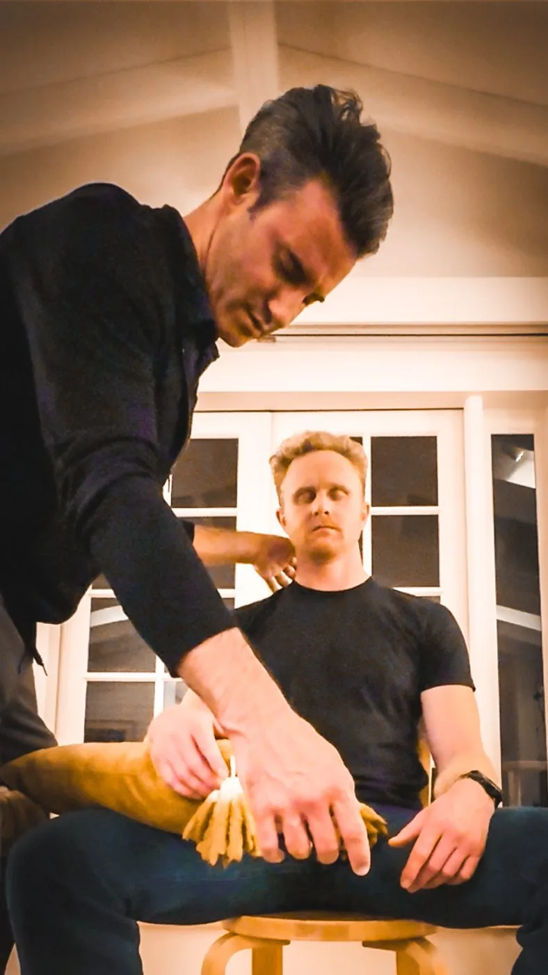 Joel treating Aren's shoulder